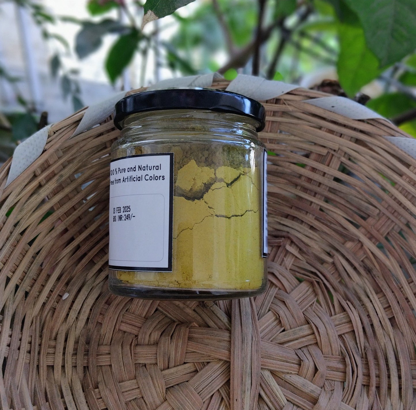 Black turmeric powder in a glass jar 